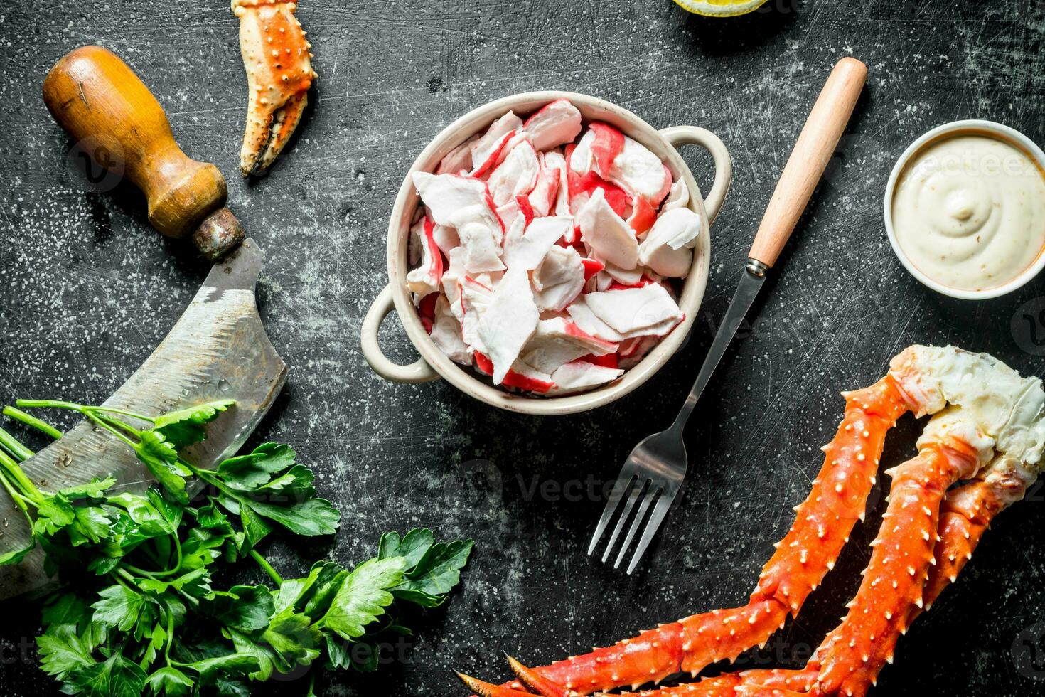 Crab meat in bowl with sauce and parsley. photo
