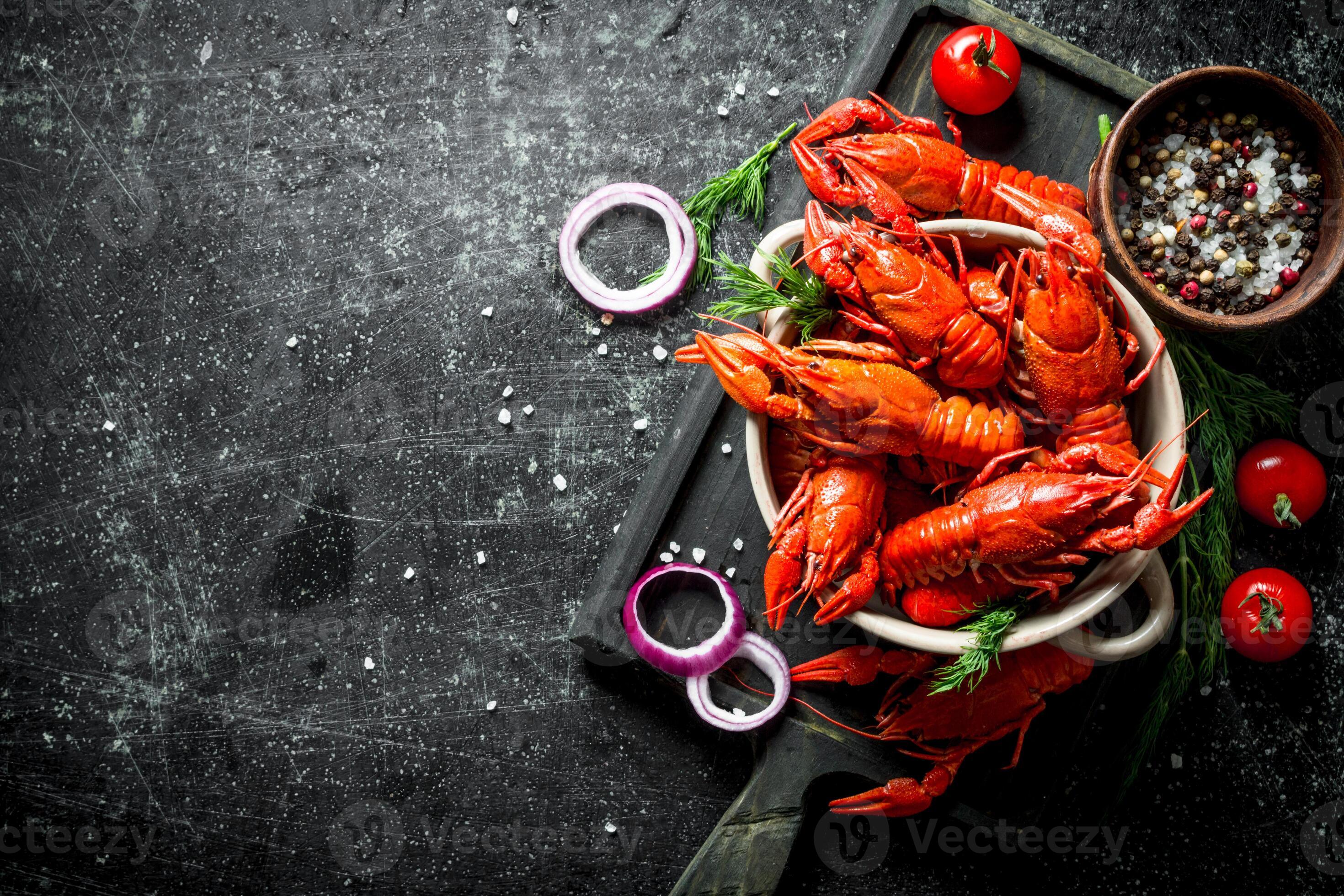 Boiled Crayfish On A Cutting Board With Onion Rings Tomatoes And Spices 32013574 Stock Photo Boiled Crayfish On A Cutting Board With Onion Rings Tomatoes And Spices 32013574 Stock Photo