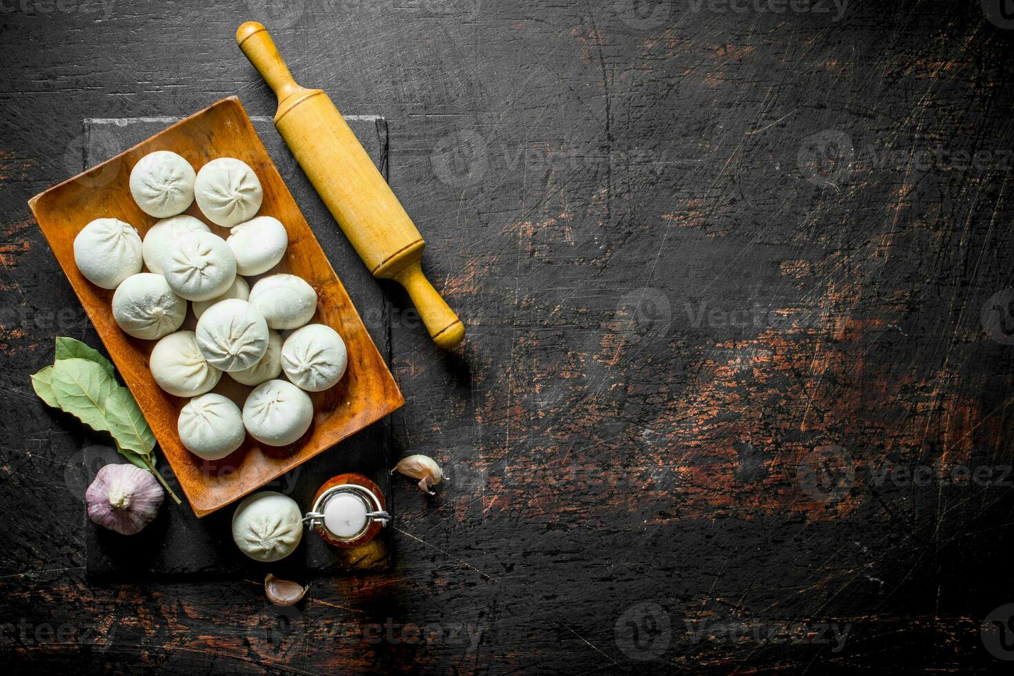 Freshly preparation raw manta dumpling with rolling pin. photo