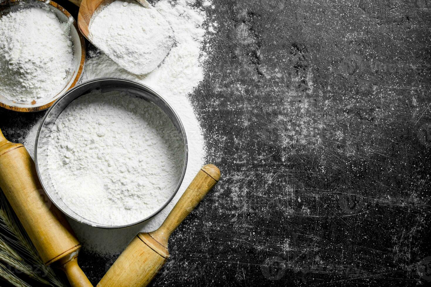 Flour in a sieve and bowl. photo