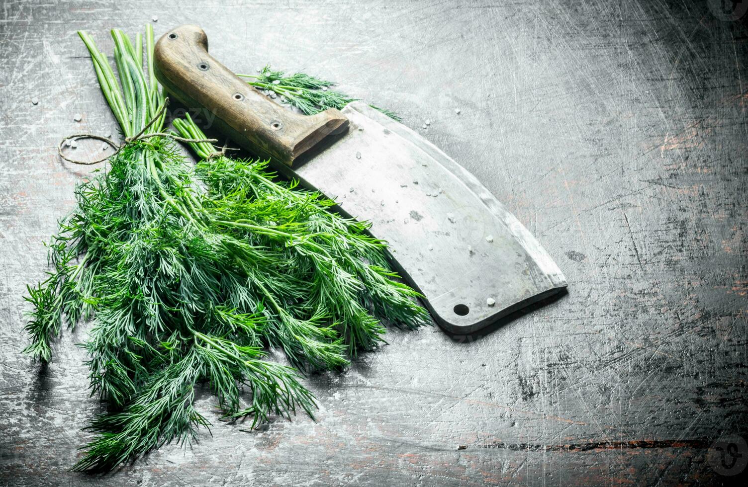 Fresh dill with big knife. photo