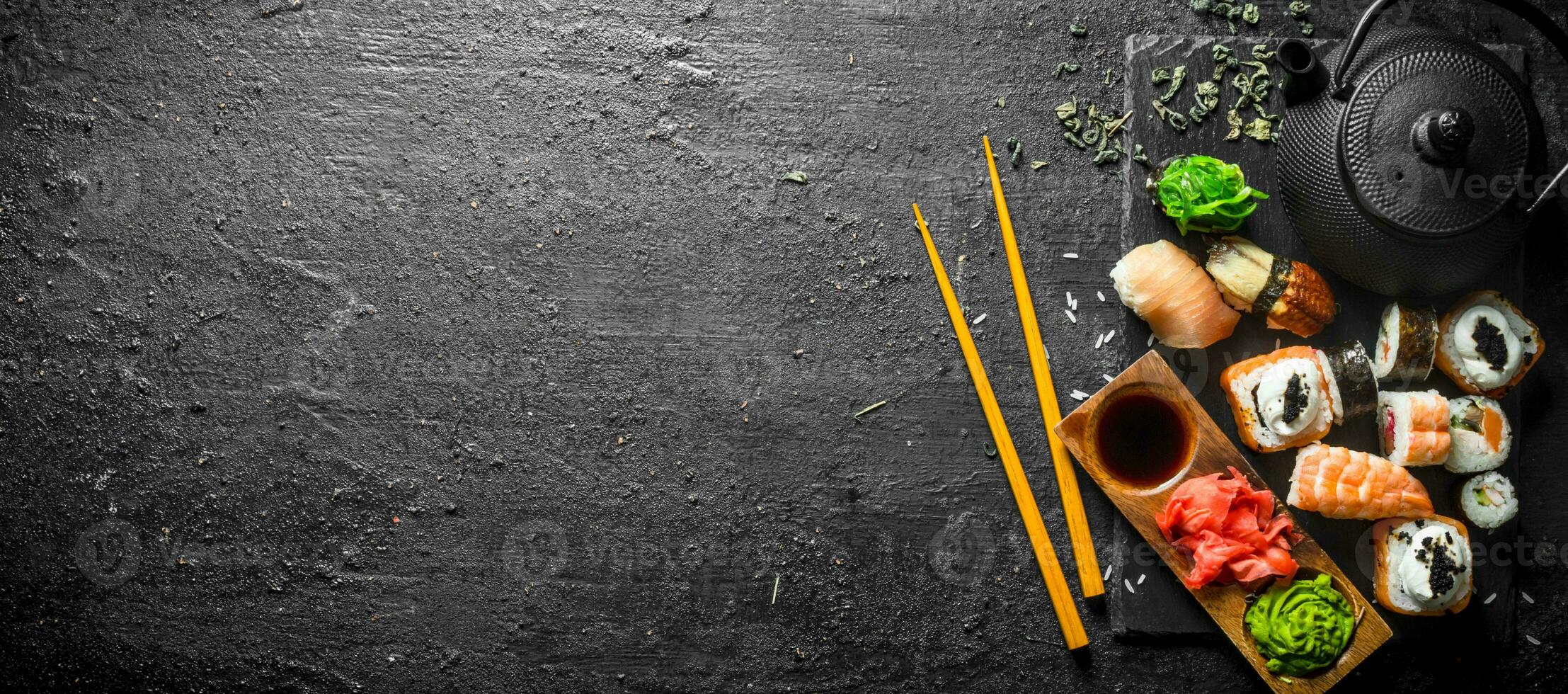 Sushi rolls with shrimp and salmon on a stone Board. photo