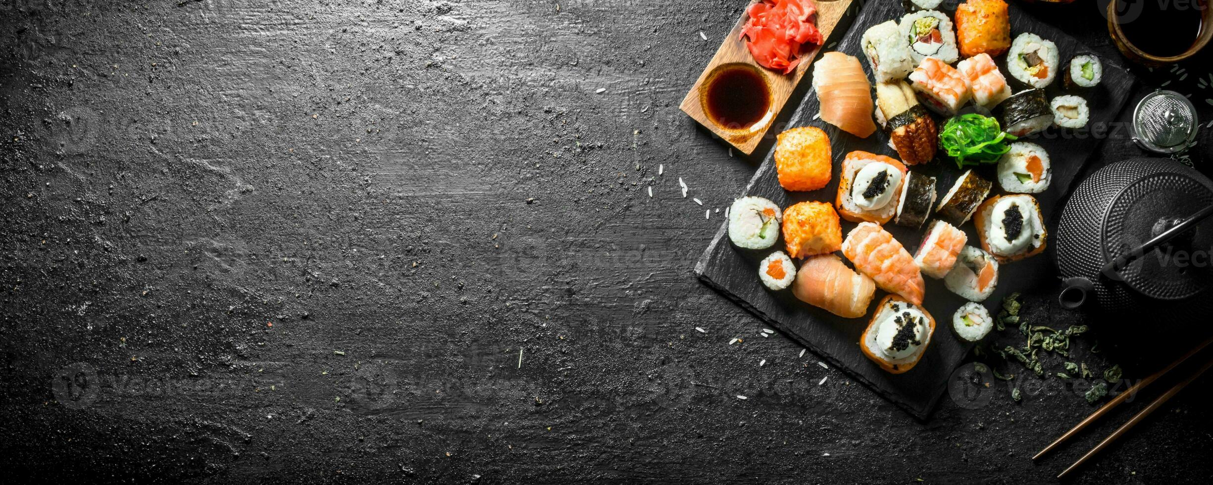 Japanese sushi rolls with salmon, avocado and shrimp. photo