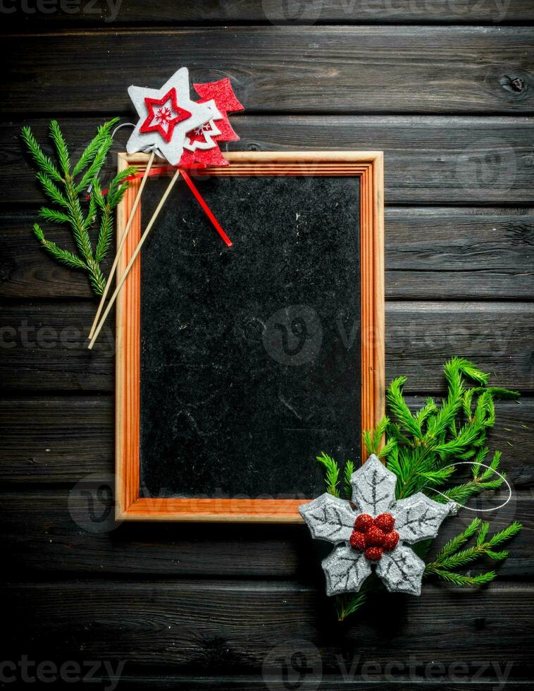 Empty Christmas frame with fir branches. photo