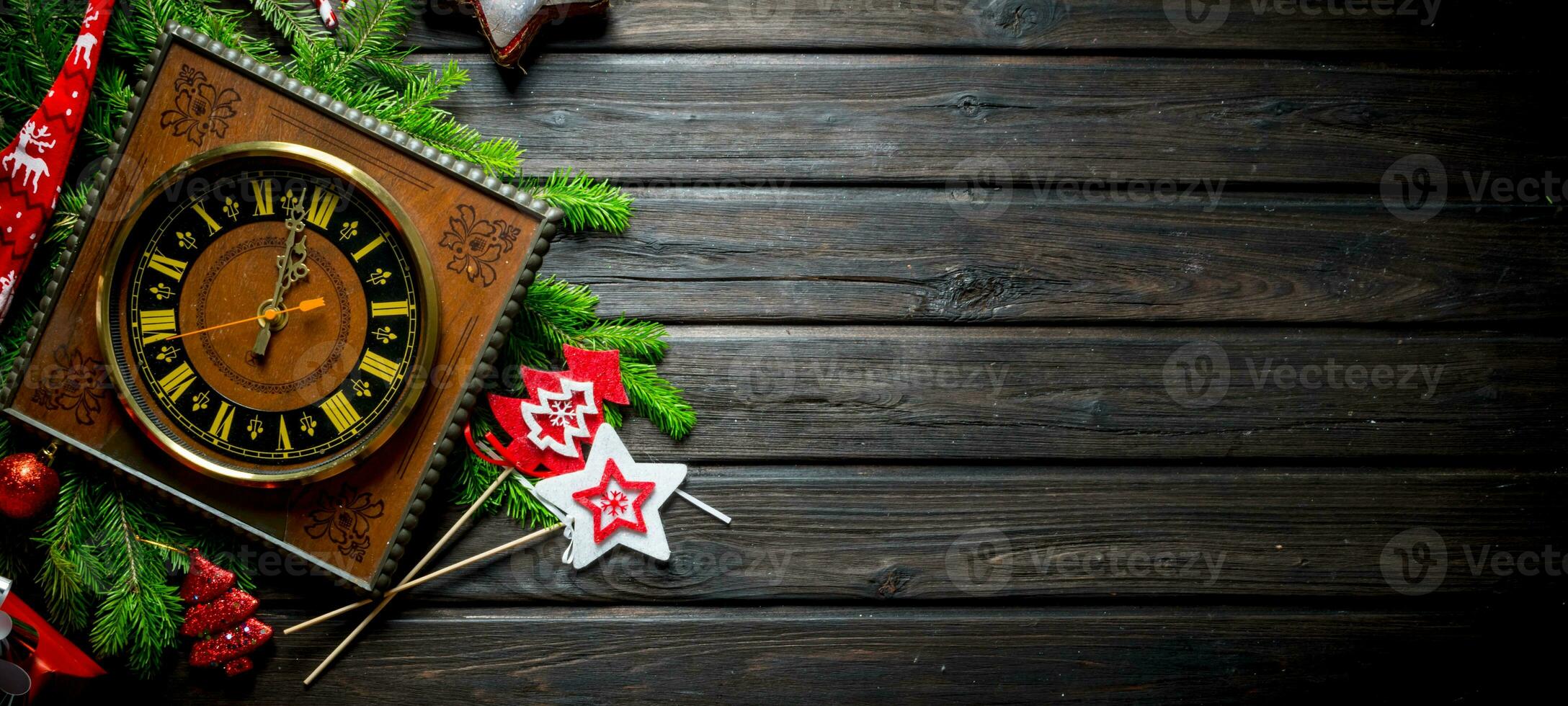 Christmas composition of old clocks, ornaments and fir branches. photo