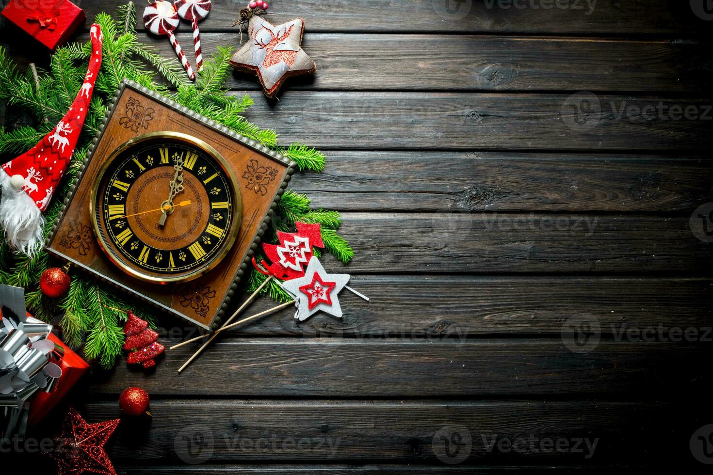Christmas composition of old clocks, ornaments and fir branches. photo