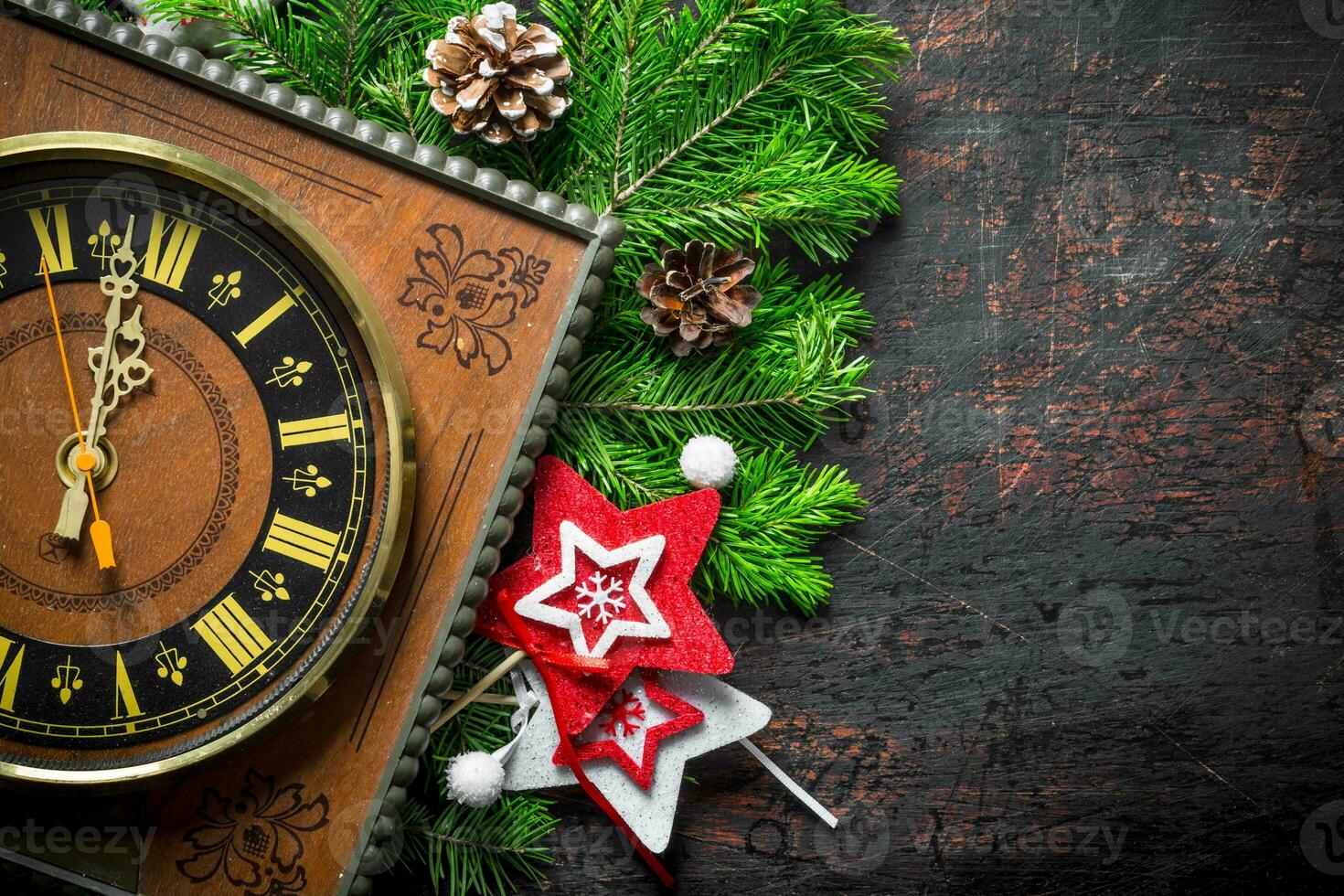 Christmas clock with fir branches and cones. photo