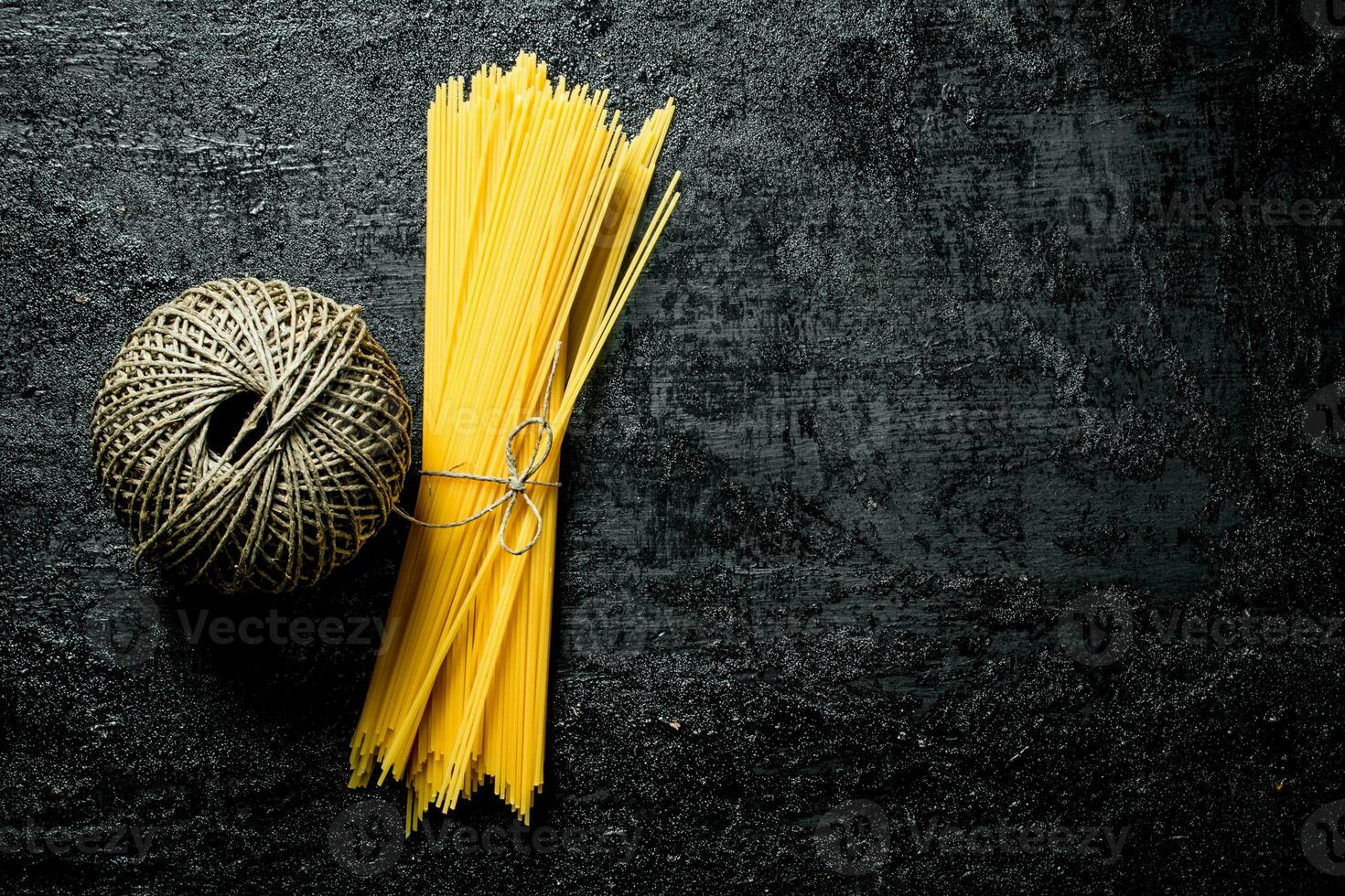 Dry spaghetti with twine. photo