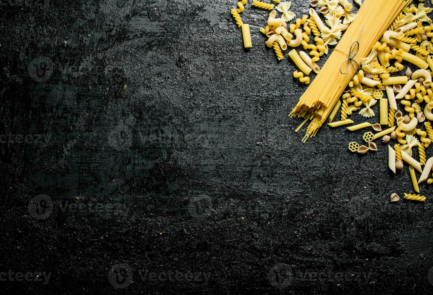 Assortment of different types of dry pasta. photo