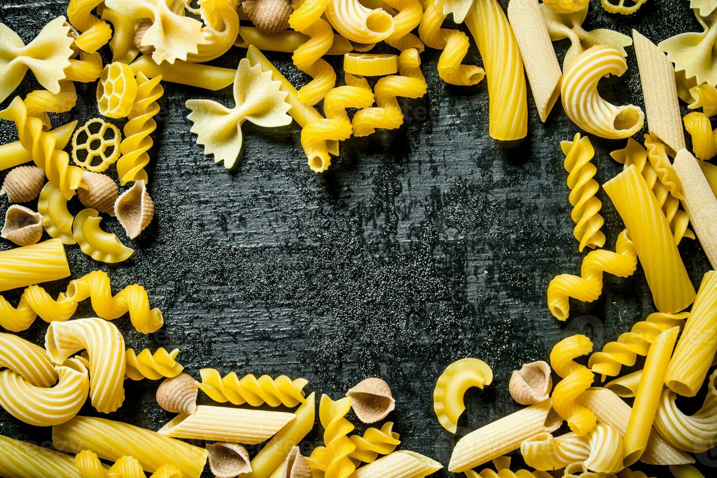 Assortment of different types of pasta dry. photo
