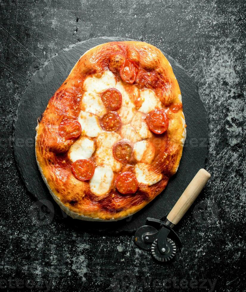 Homemade pizza on a stone Board. 32017130 Stock Photo at Vecteezy
