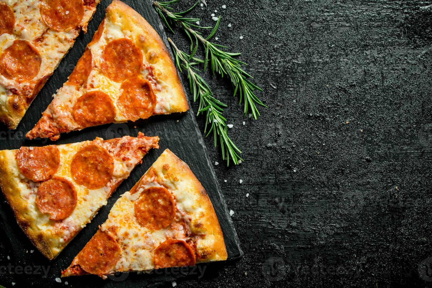 Slices of fragrant pepperoni pizza on a stone Board. 32017157 Stock Photo at Vecteezy