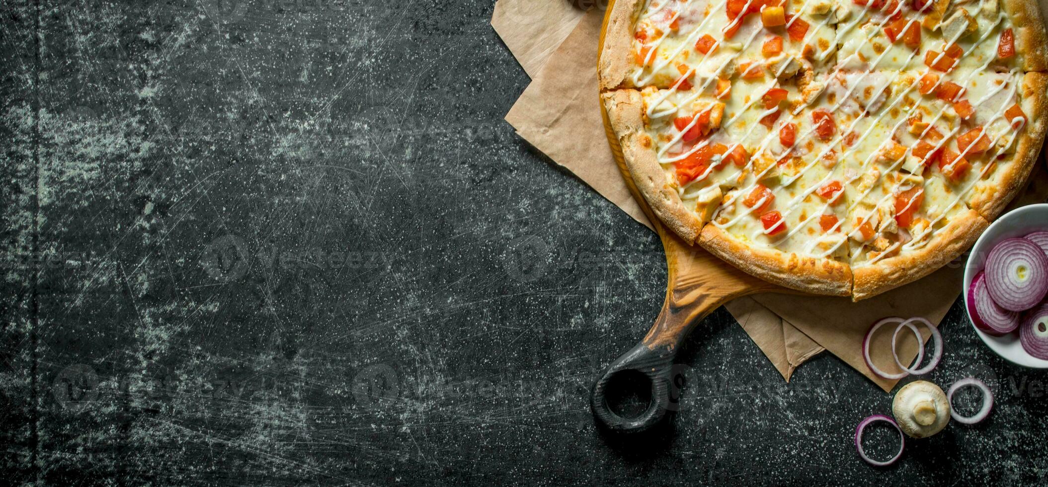 Pizza with chicken and cheese sauce. photo
