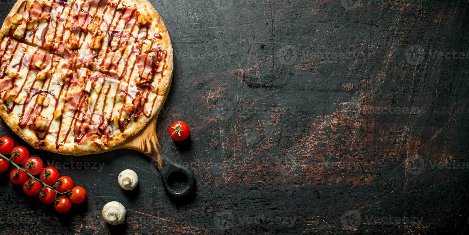Hot BBQ pizza with bacon and cheese. photo