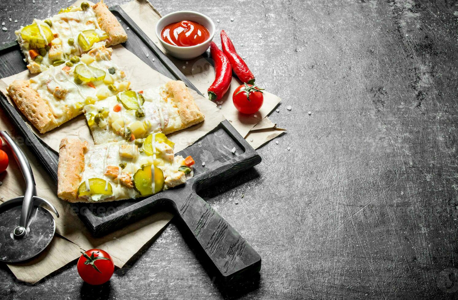Slices of vegetable pizza with cucumbers and cheese sauce. photo