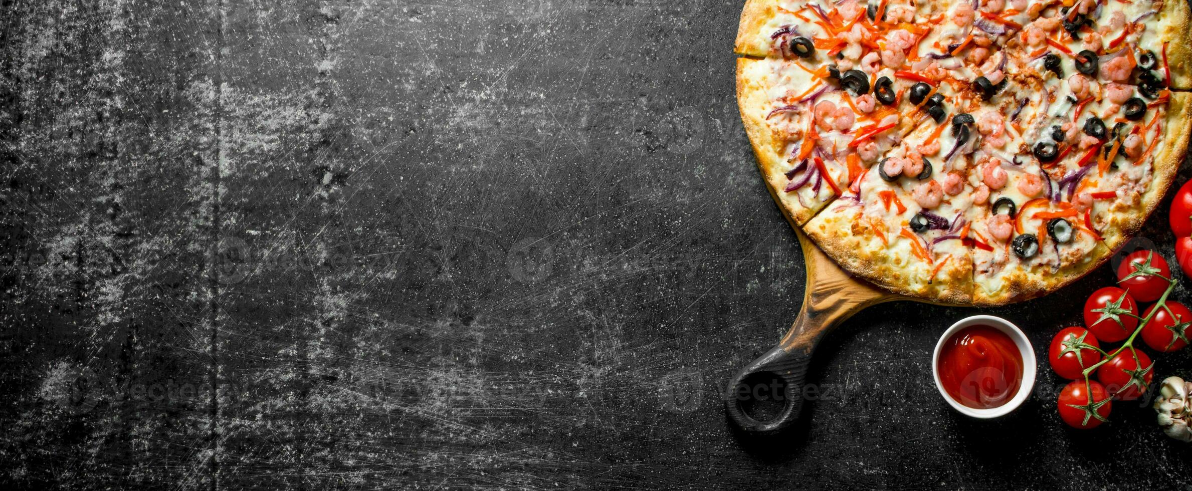Sea pizza and tomato sauce in bowl. photo