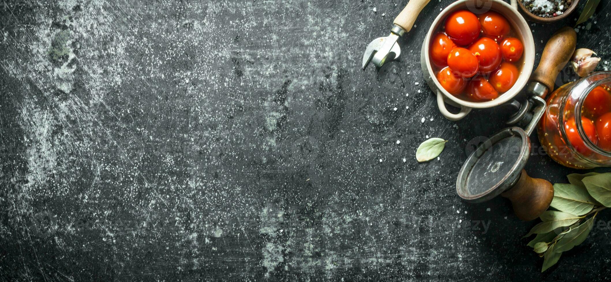 Preserved tomatoes with Bay leaf and garlic. photo