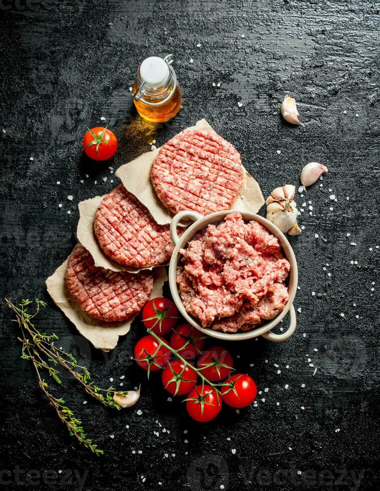 Minced beef Burger with tomatoes, oil and garlic. photo