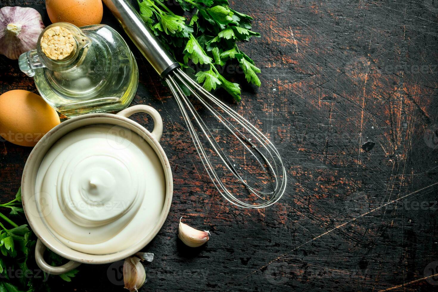Mayonnaise with herbs, oil and garlic. photo