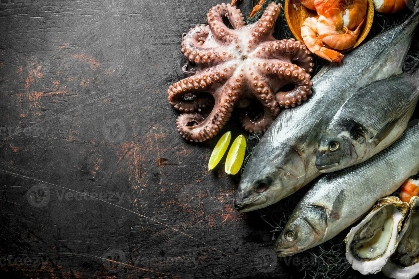 Various seafood with slices of lime. photo