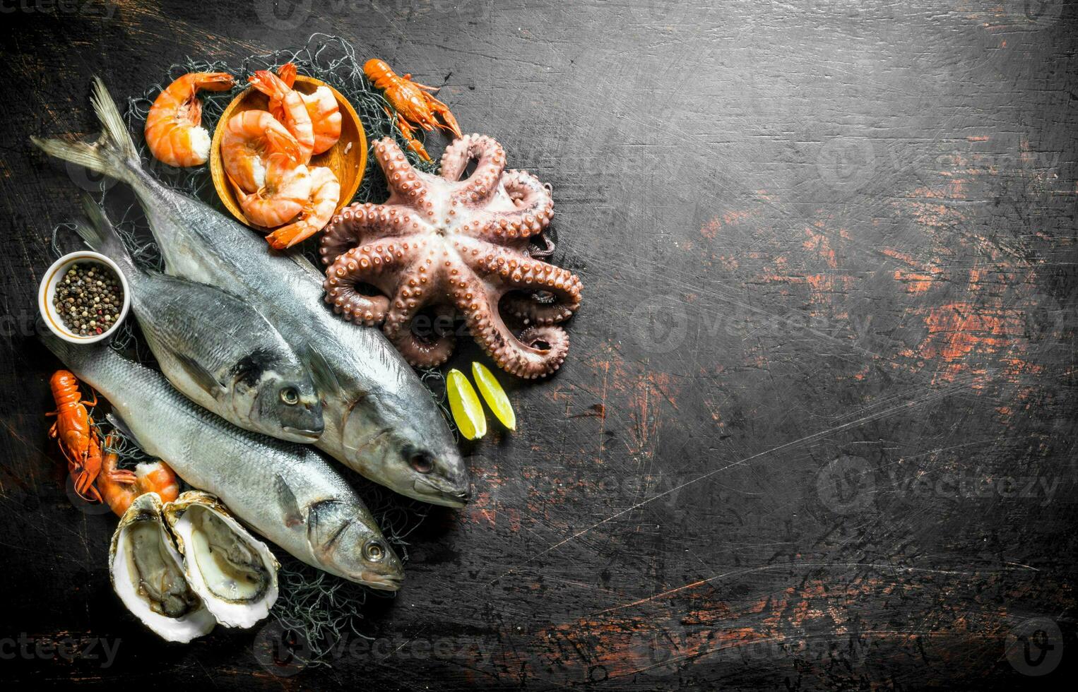 Fresh seafood with spices and lime slices. photo