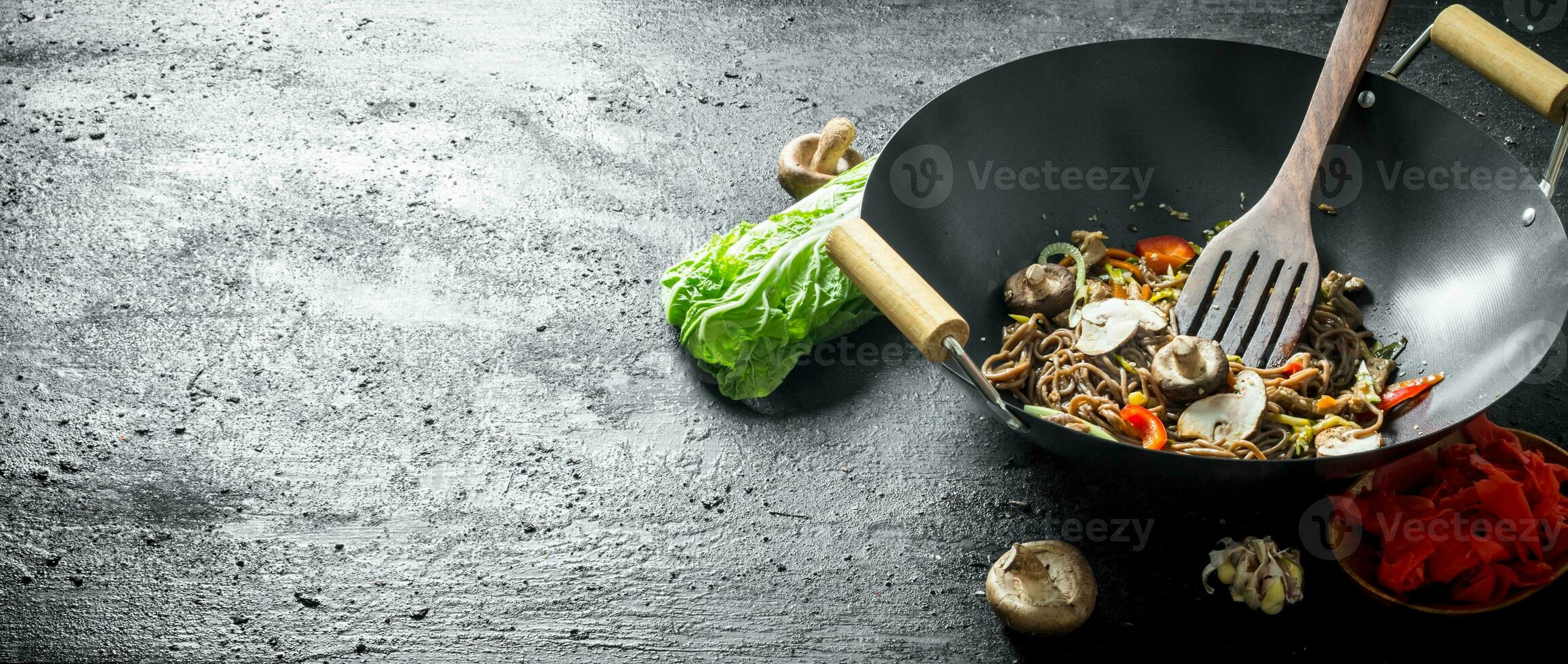 Fragrant soba noodles in a wok pan. photo