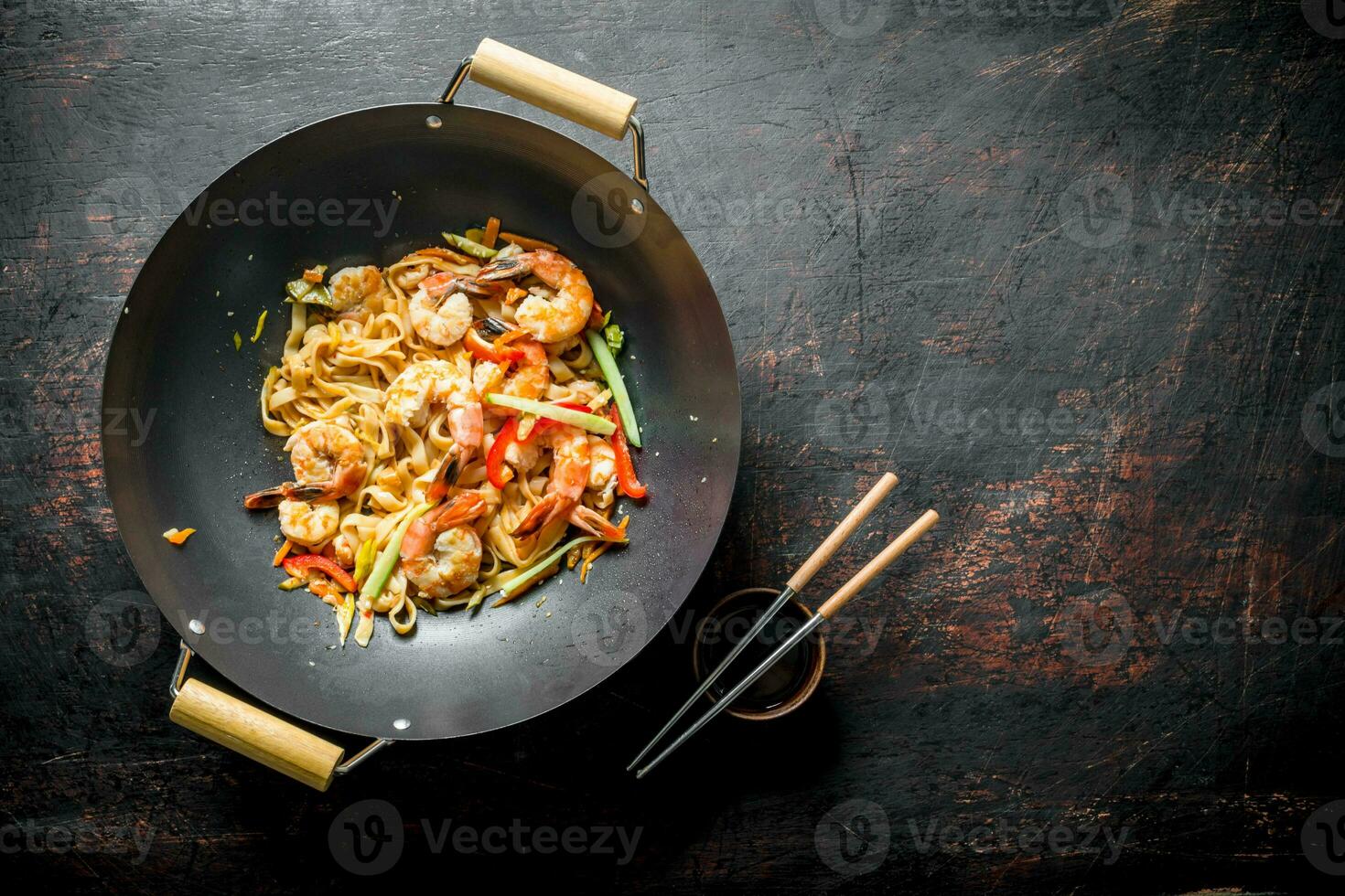 Freshly cooked Asian Udon noodles with vegetables and shrimp. photo