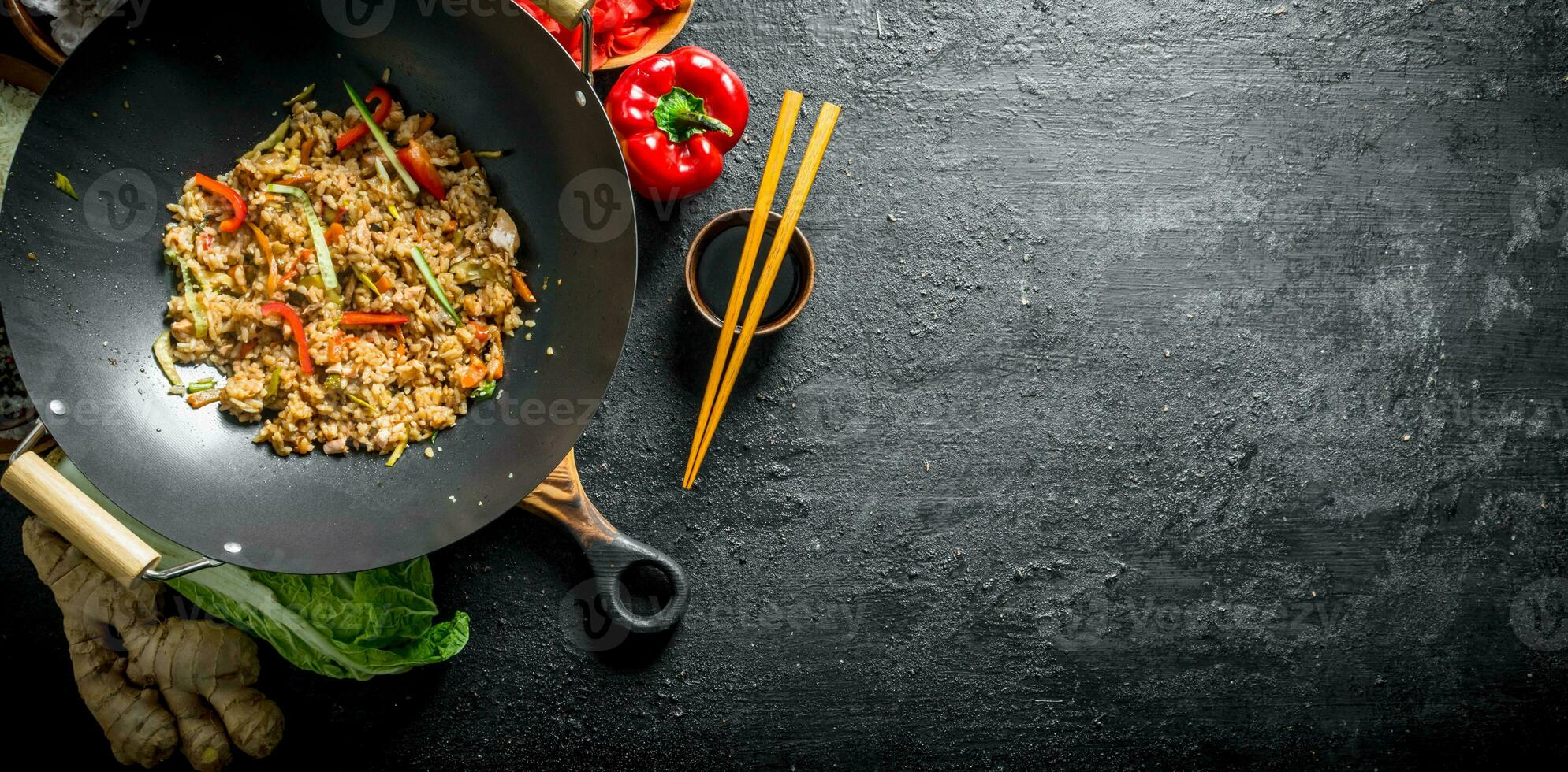 Freshly cooked Chinese wok rice with vegetables and beef. photo