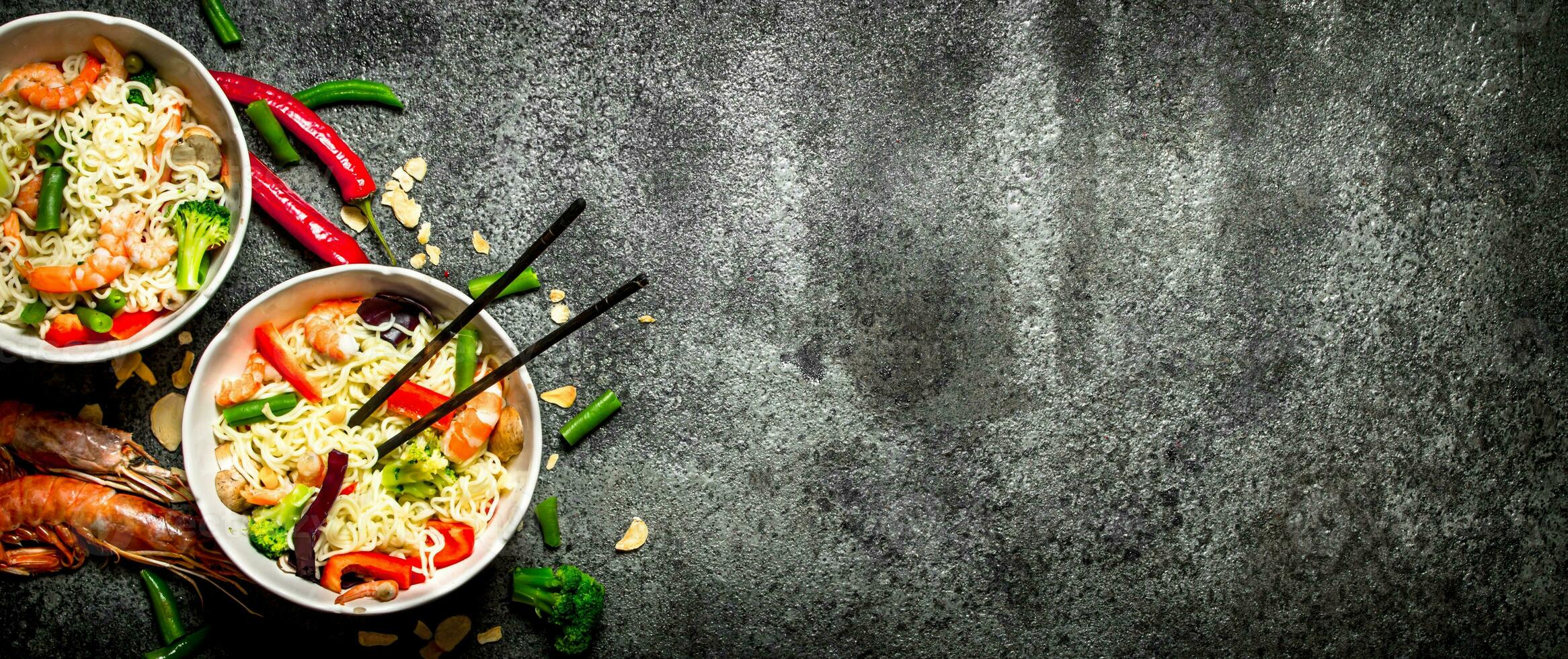 Asian food. Chinese noodles with vegetables and shrimp. photo