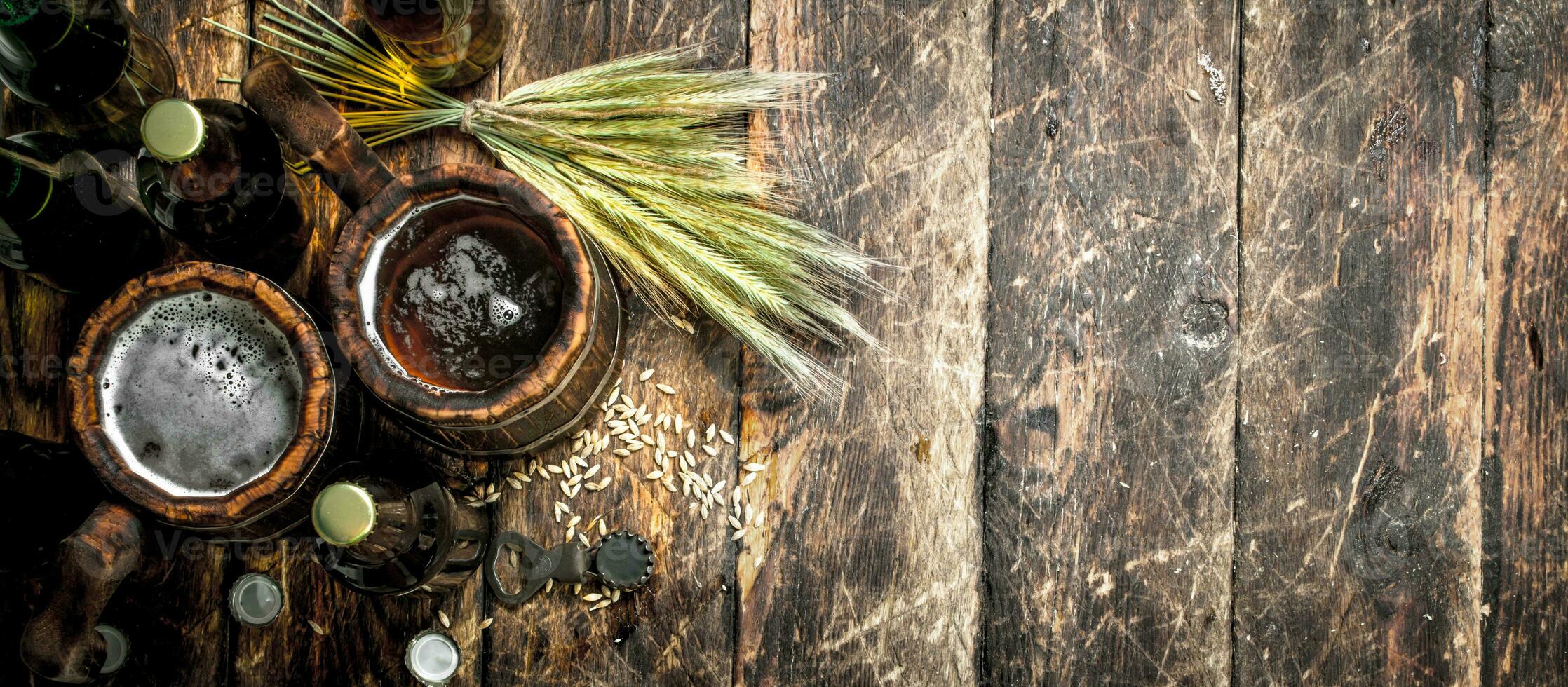 Fresh beer in a wooden mug. photo