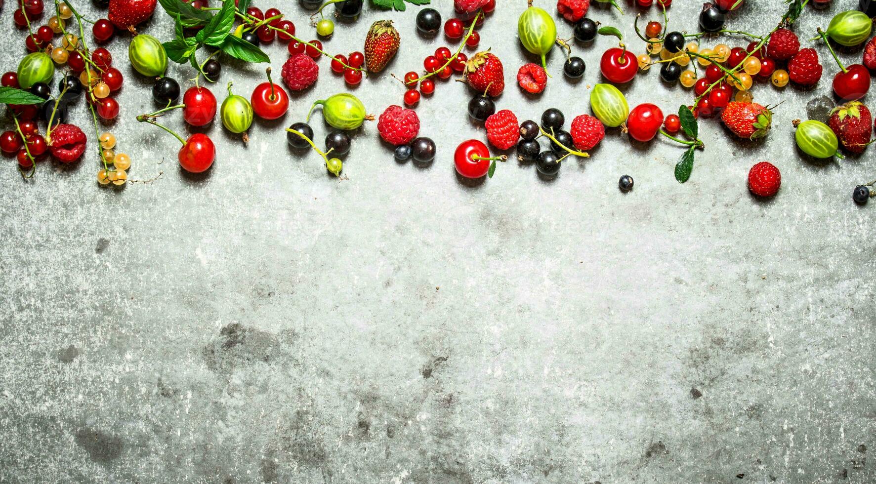 wild berries on the stone table. photo