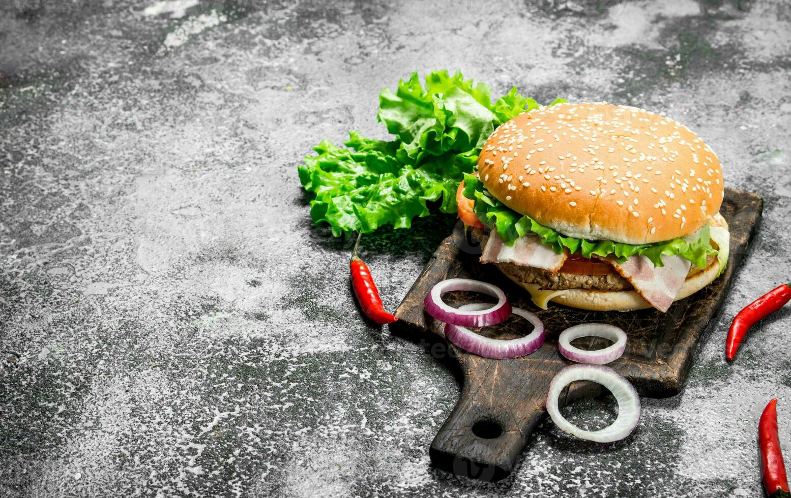 Hot burger with beef, vegetables and chili peppers. photo