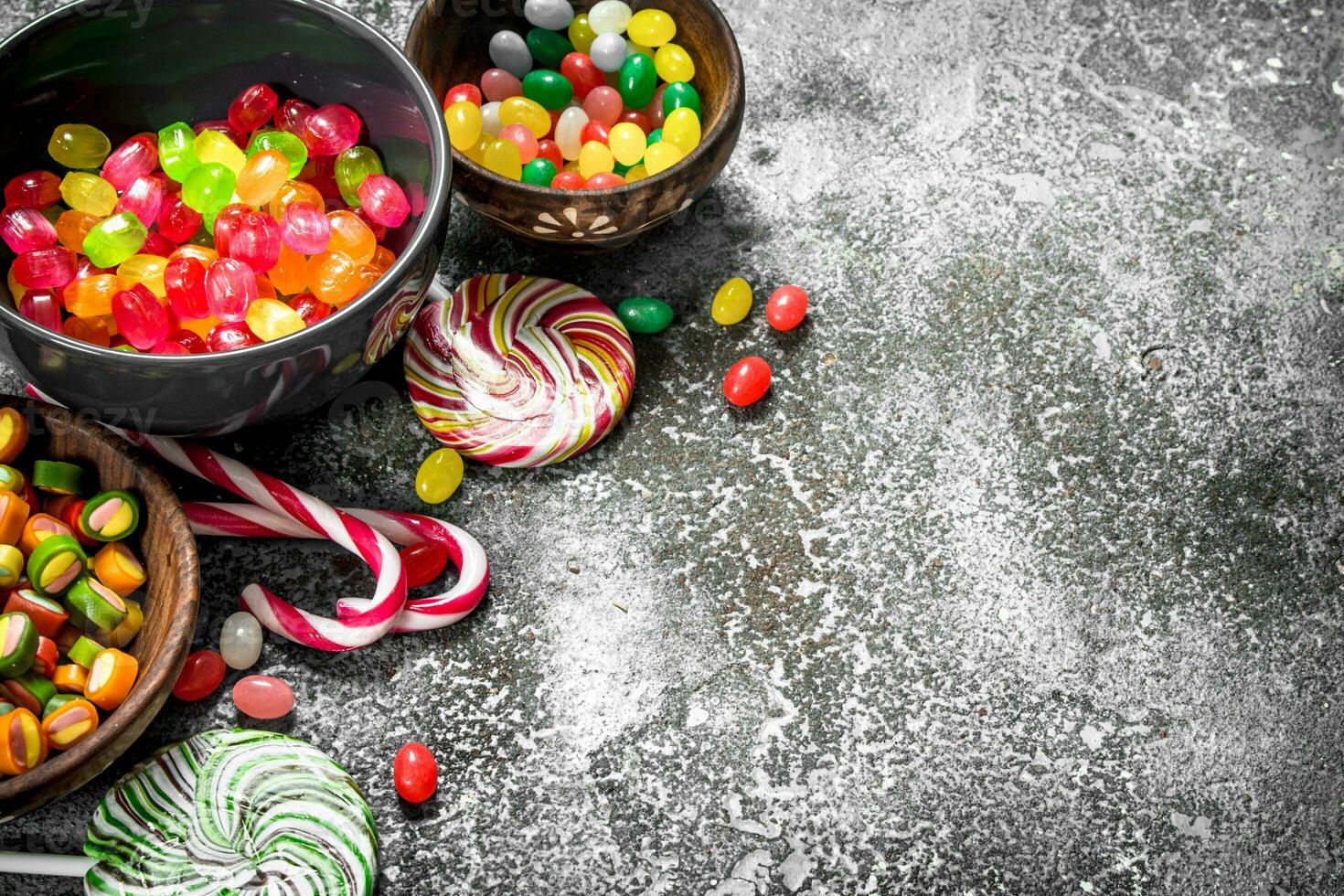 Multicolored candy, jelly and marshmallows in a bowl. photo