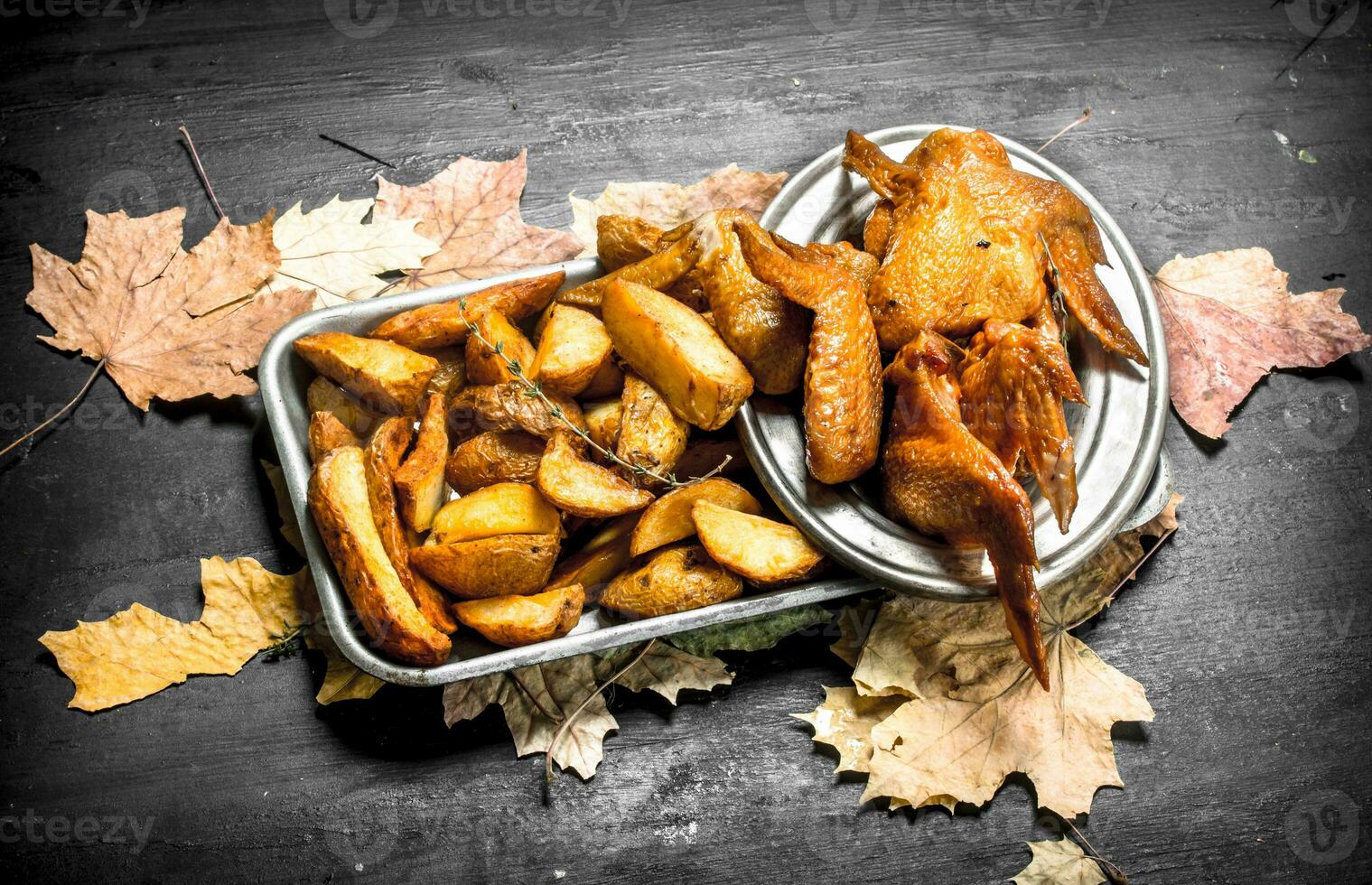 Smoked chicken wings with fried potatoes. photo