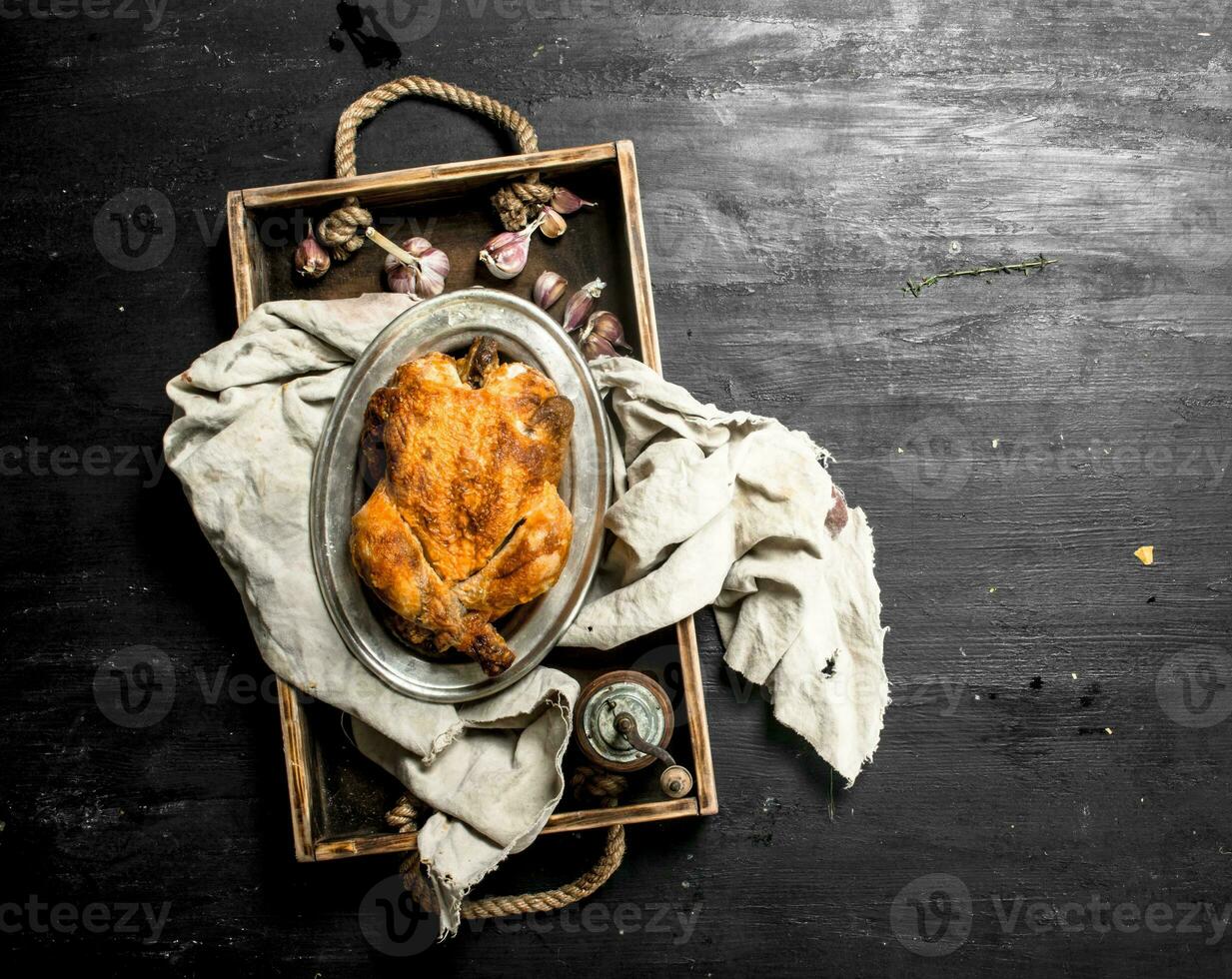 Fried chicken on an old tray. photo