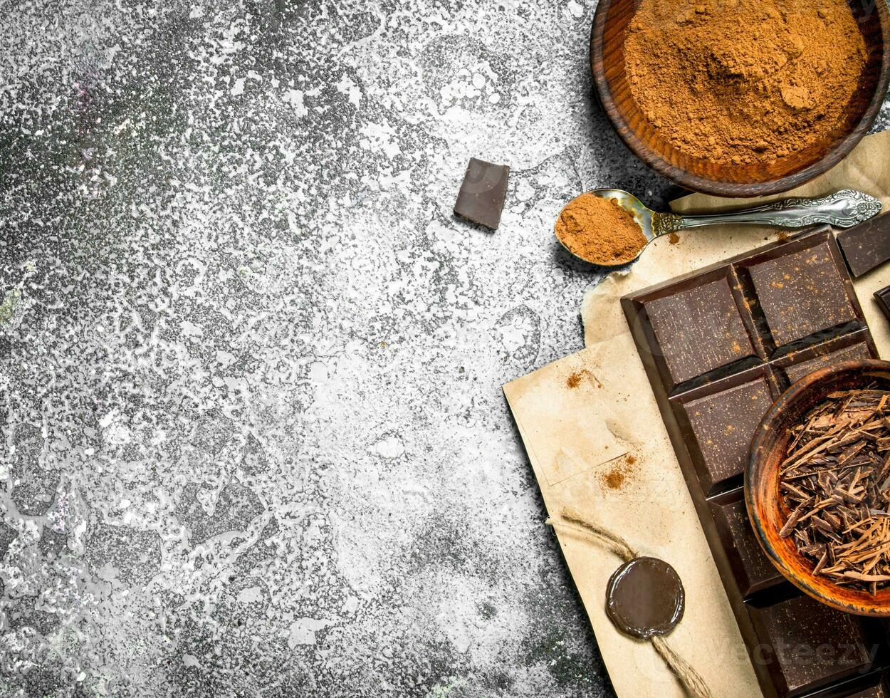 chocolate bar with cocoa powder. photo