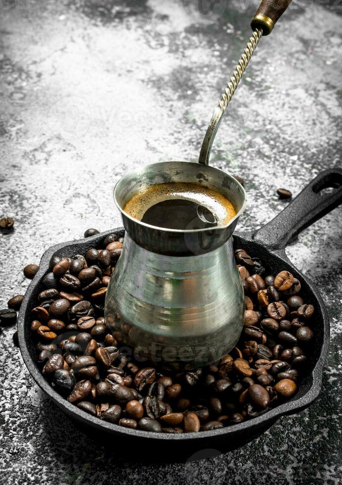 Fresh coffee in the Turk. photo