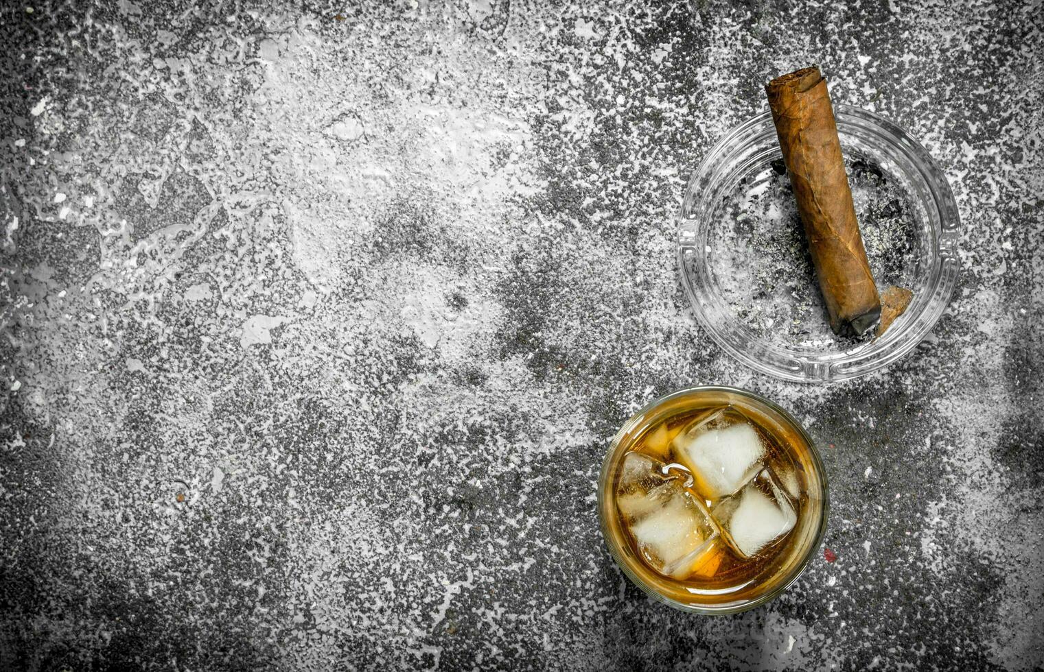 glass of whiskey with a cigar. photo