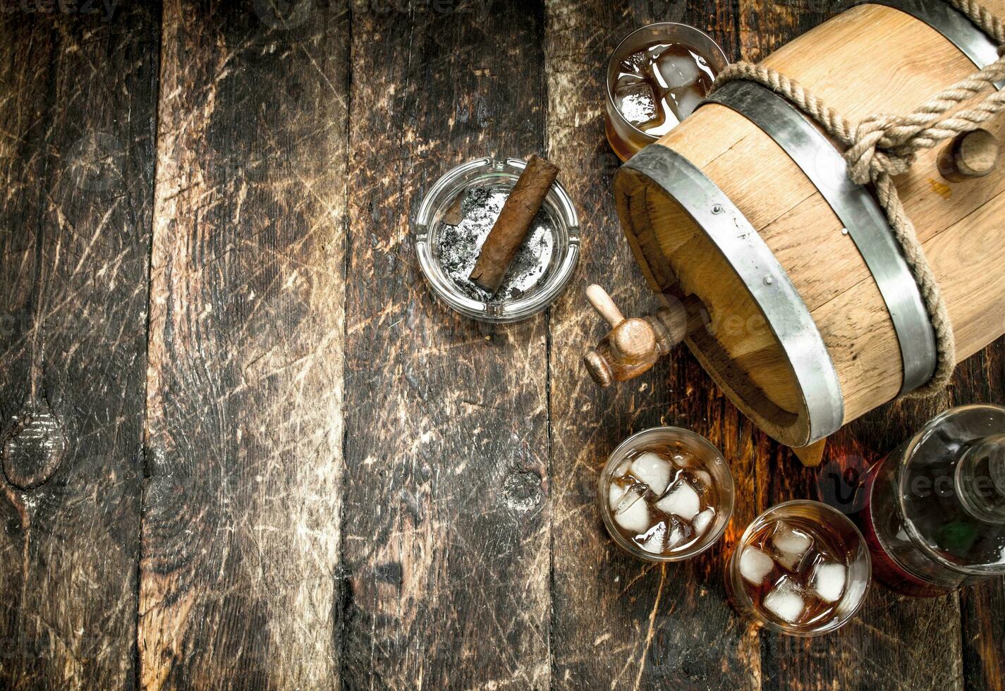 barrel of Scotch whiskey with a glass. photo