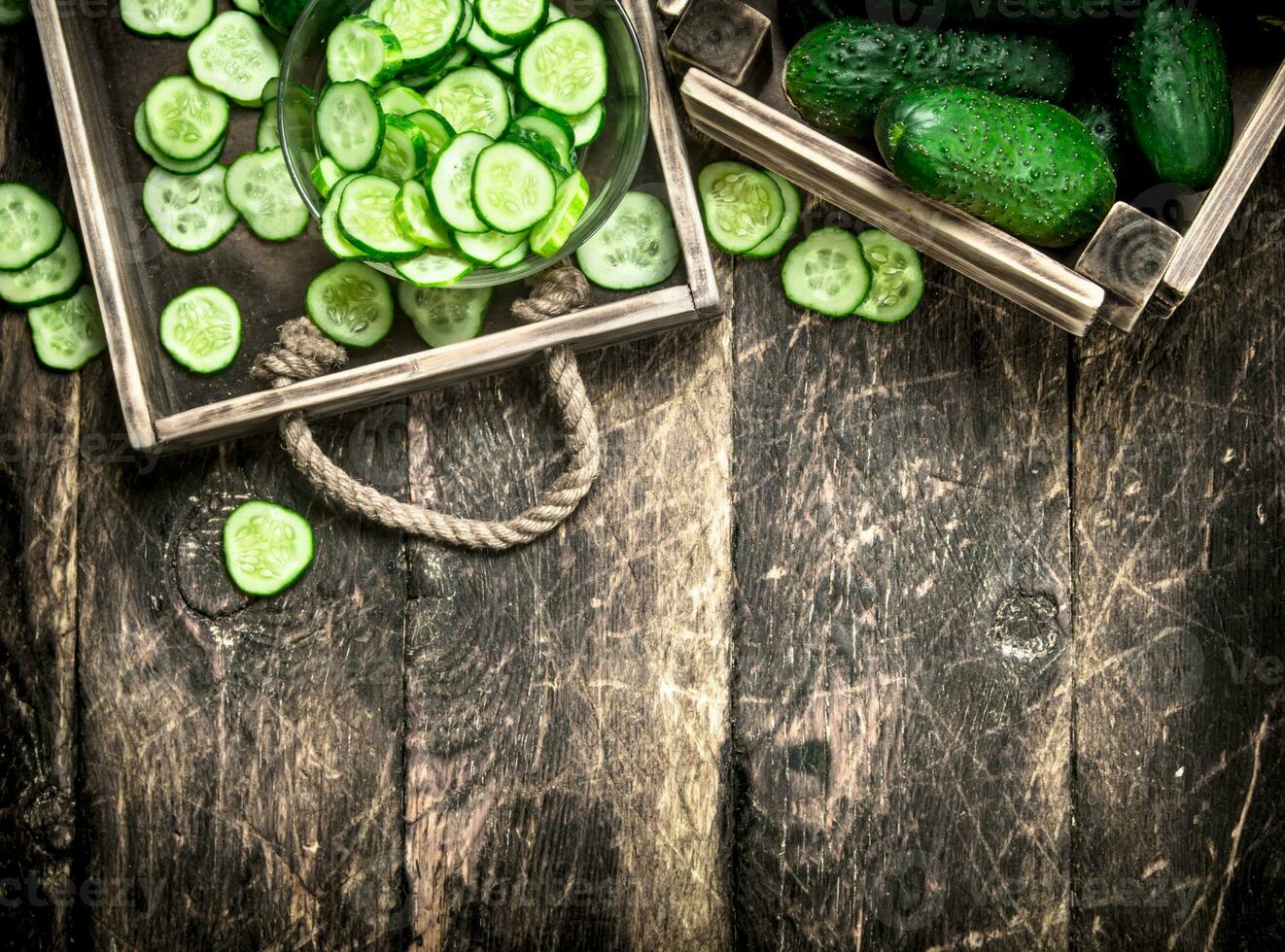 Fresh cucumbers in an old box. photo