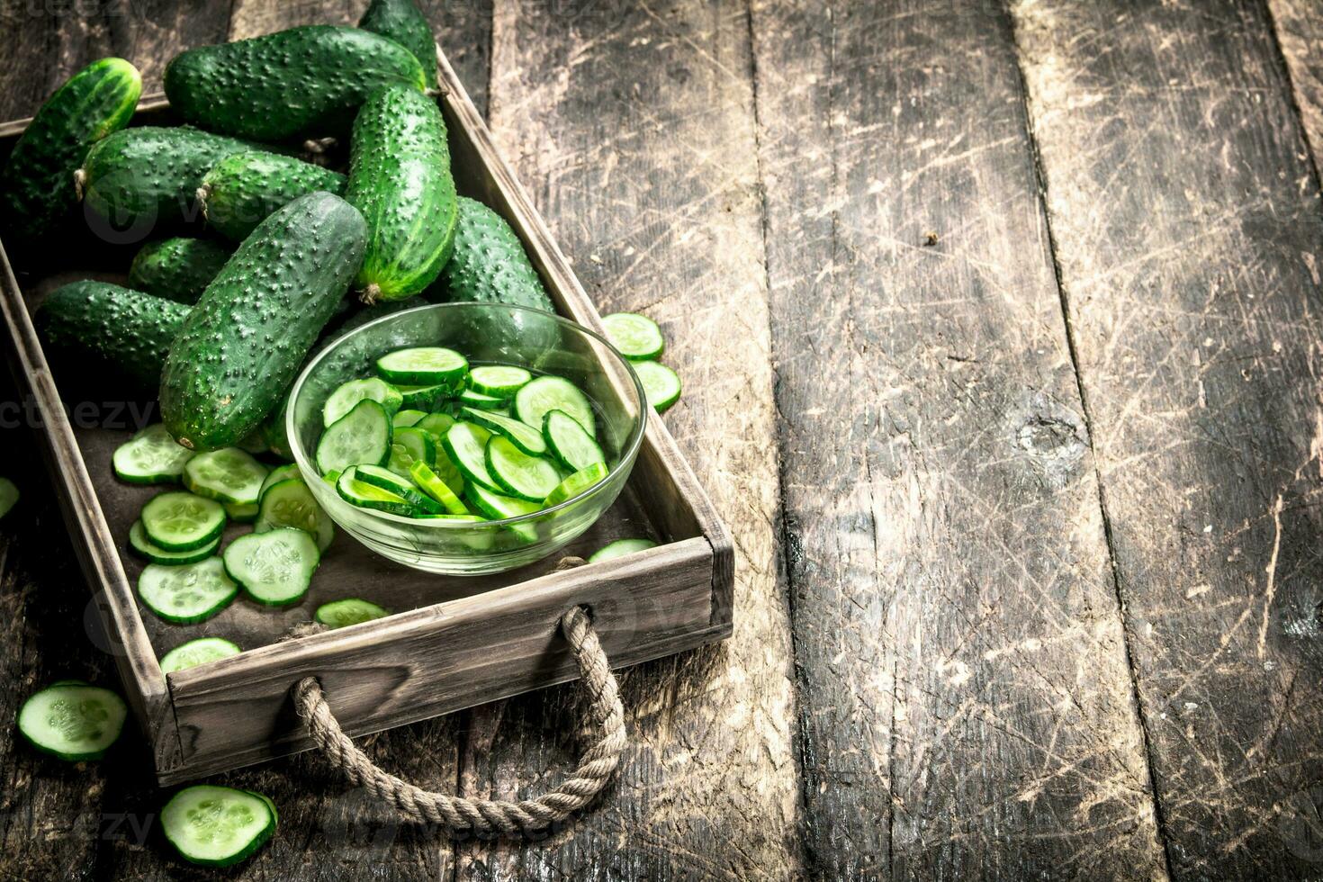 fresh cucumber on an old tray. photo