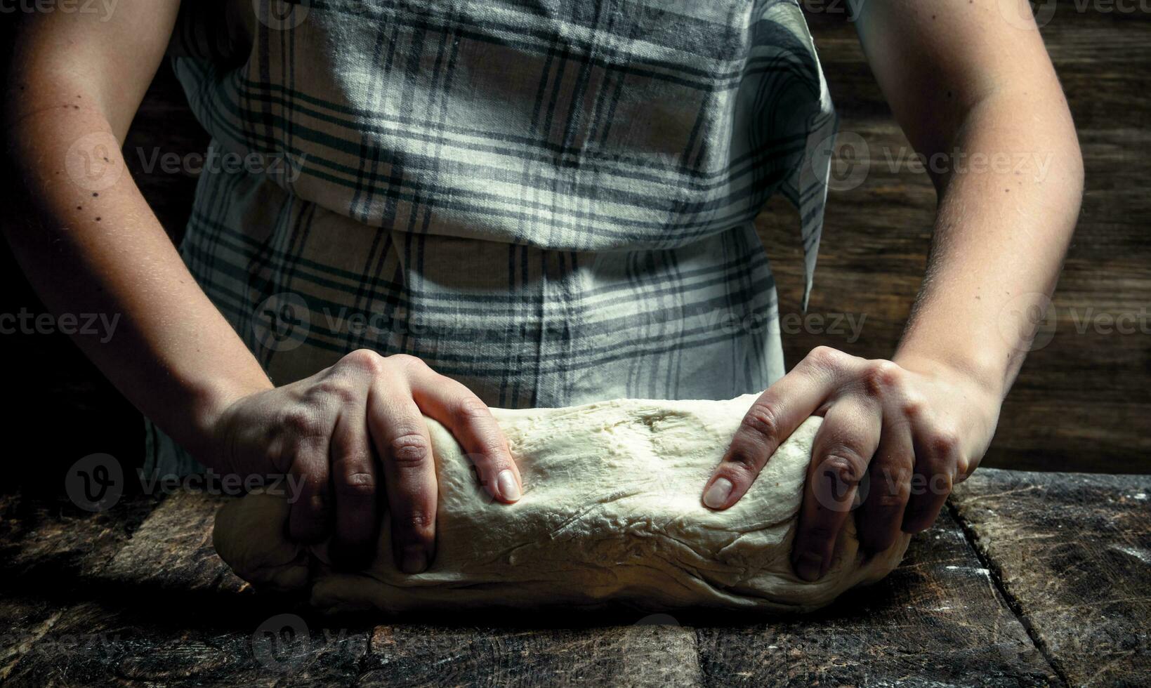Dough background. A woman is preparing a dough. photo