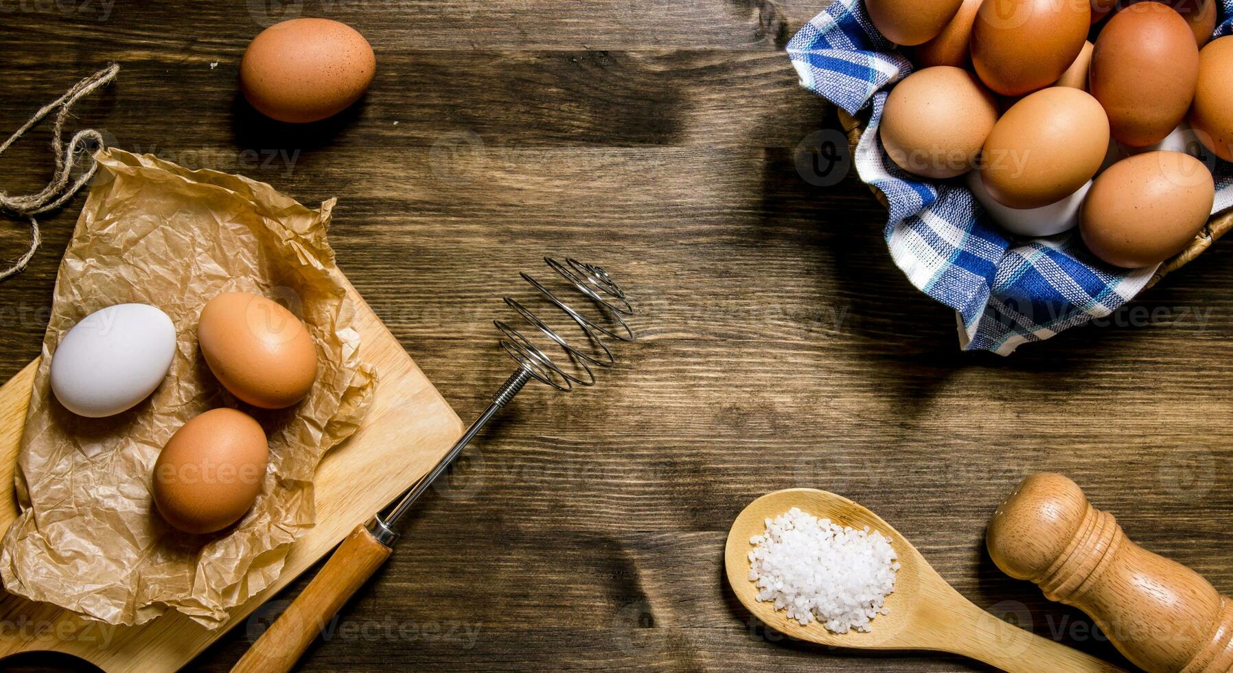 Eggs the background. The eggs in the bowl with the whisk. photo