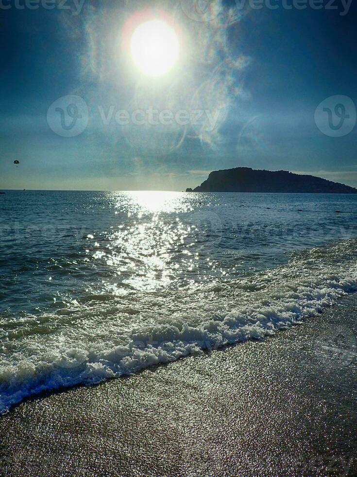 photo of a beach in Turkey in Alanya on a beautiful summer day stylized as an old photographA beautiful photo of a beach in Turkey in Alanya on a beautiful summer day stylized as an old photograph