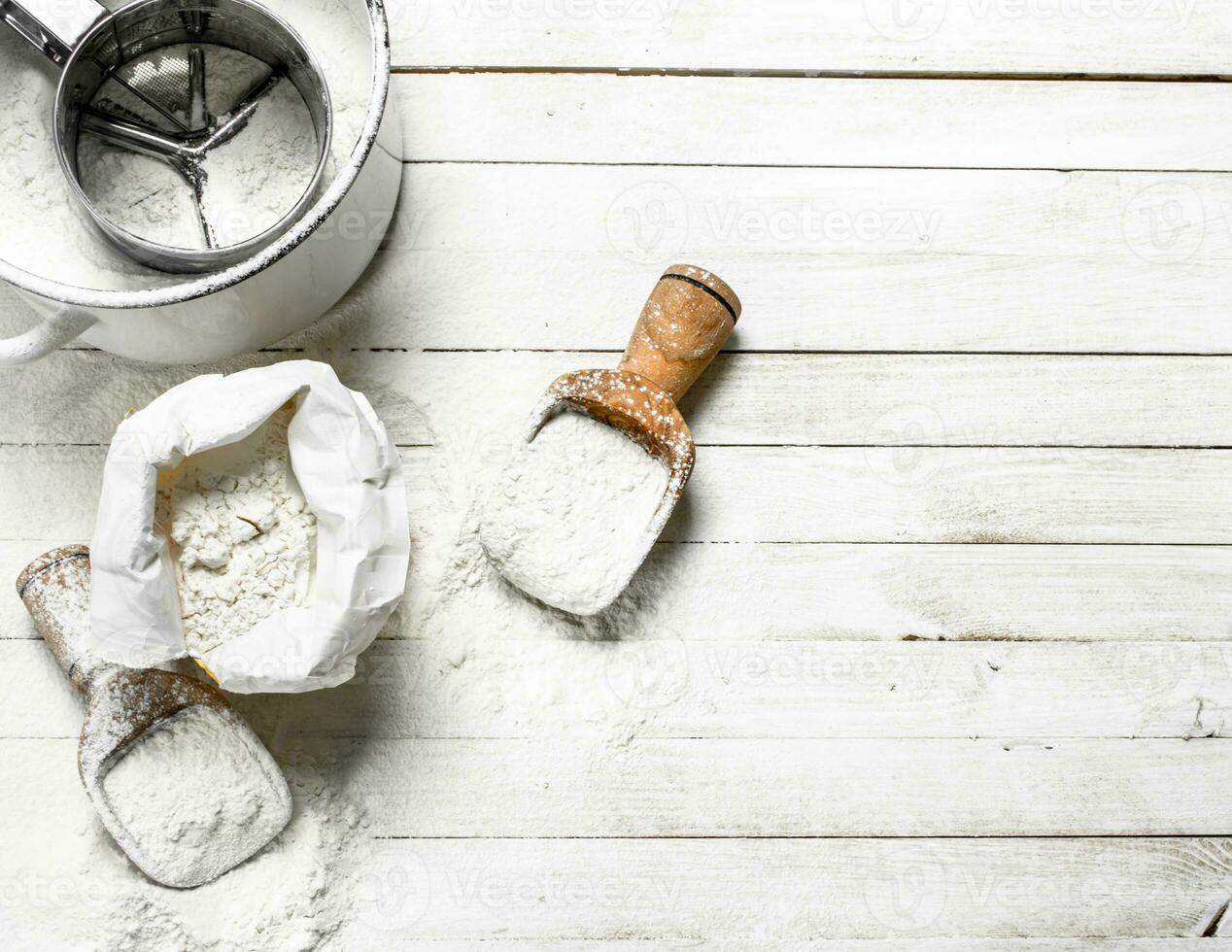 Flour in bag with a shovel. photo