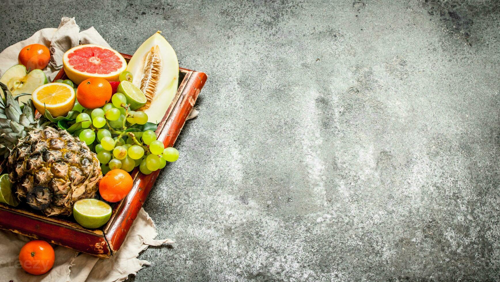 Ripe fruits in the old tray. photo