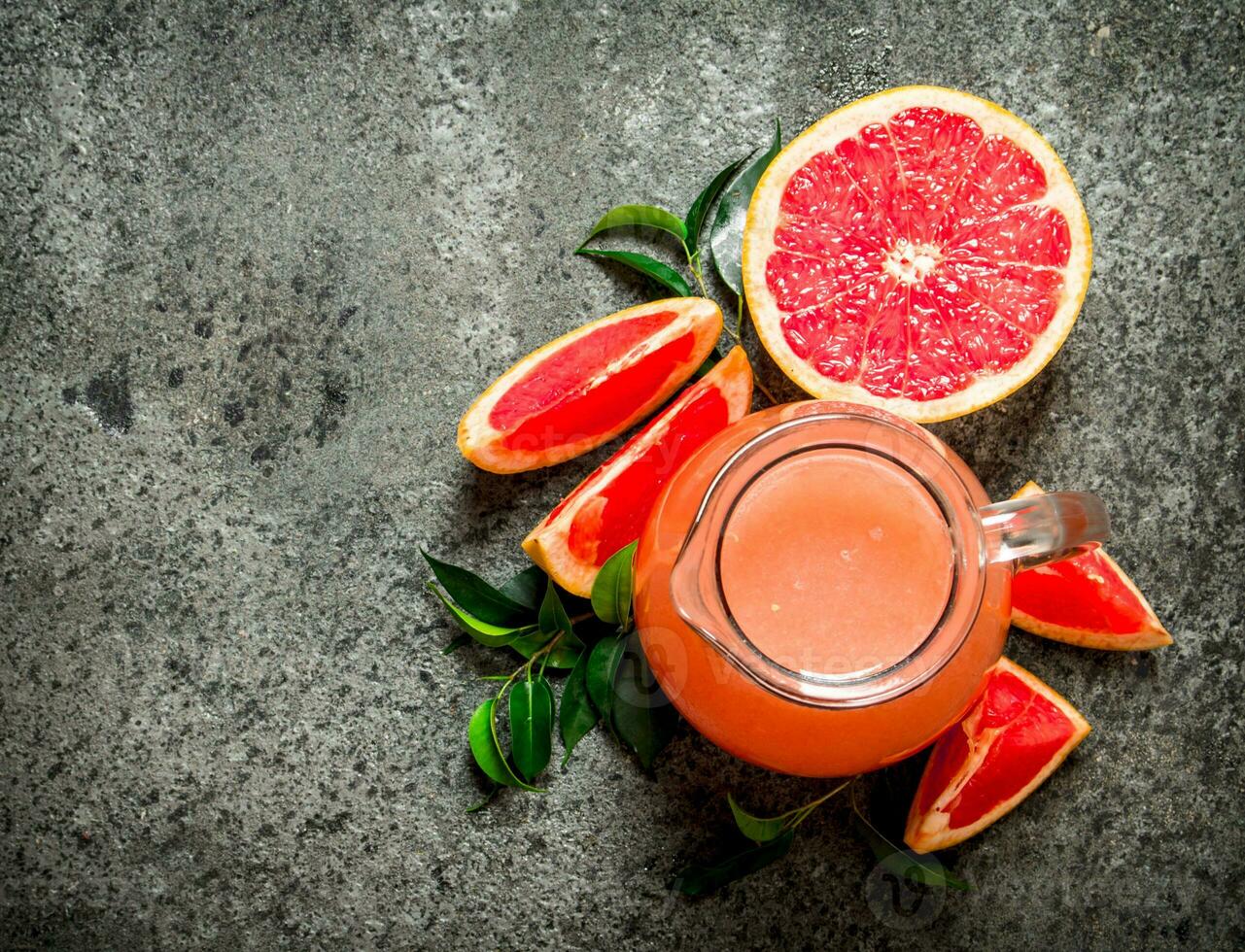 Fresh juice from grapefruits. photo