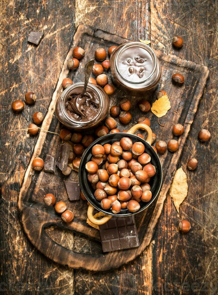 Nut butter with chocolate and hazelnuts. photo