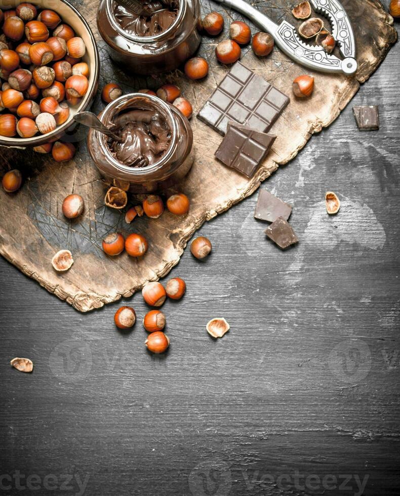 Chocolate butter with hazelnuts. photo