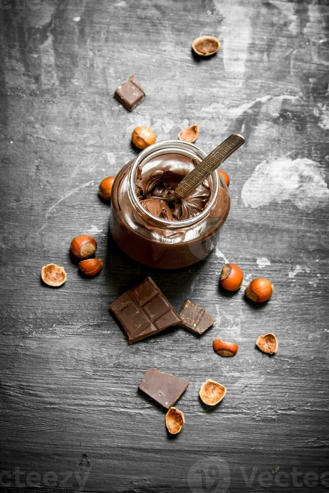 Chocolate butter with hazelnuts. photo